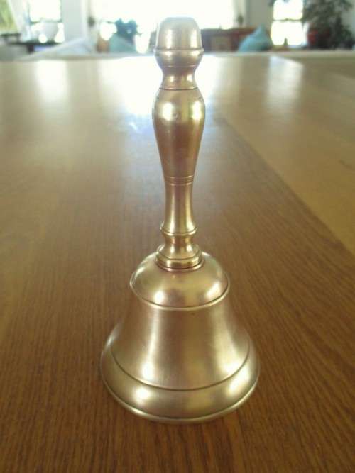 A VINTAGE ALL-BRASS BELL WITH ORIGINAL CLANGER