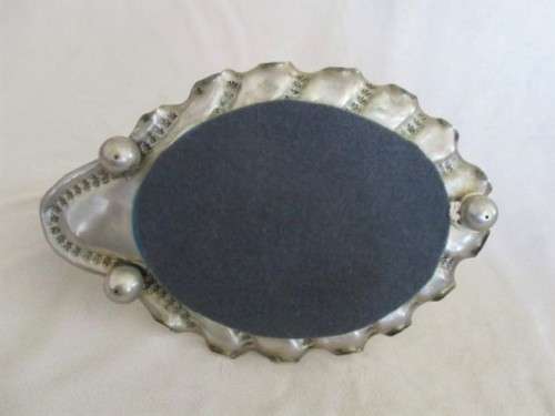 ANTIQUE AND UNIQUE - SILVER METAL FRAMED MIRROR WITH WARTHOG TOOTH HOOK/HANDLE