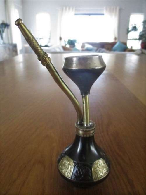 A VINTAGE METAL AND BRASS OPIUM PIPE FROM INDIA