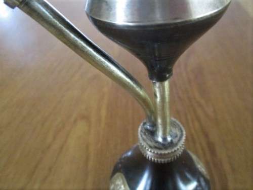 A VINTAGE METAL AND BRASS OPIUM PIPE FROM INDIA