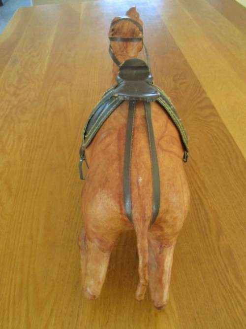 TWO ENORMOUS VINTAGE LEATHER CLAD MIDDLE EASTERN CAMELS