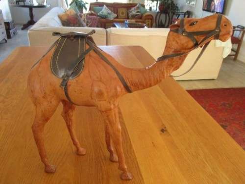 TWO ENORMOUS VINTAGE LEATHER CLAD MIDDLE EASTERN CAMELS
