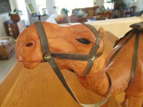 TWO ENORMOUS VINTAGE LEATHER CLAD MIDDLE EASTERN CAMELS