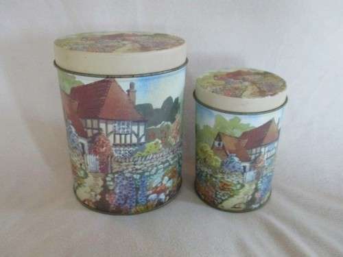 A SET OF TWO PRETTY COTTAGE-STYLE TINS