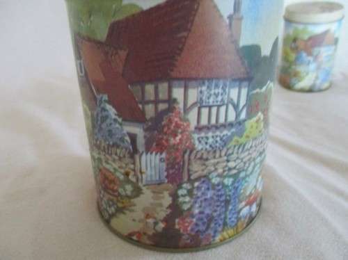 A SET OF TWO PRETTY COTTAGE-STYLE TINS