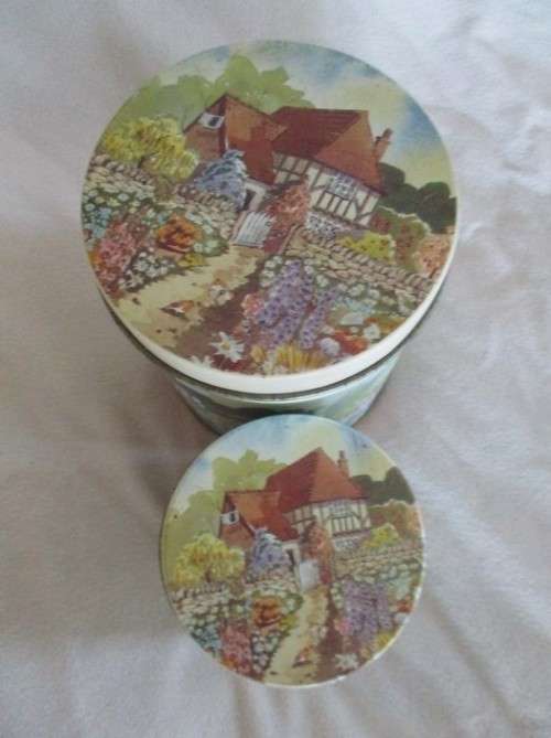 A SET OF TWO PRETTY COTTAGE-STYLE TINS