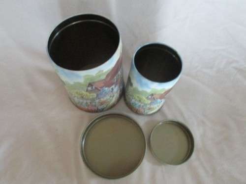 A SET OF TWO PRETTY COTTAGE-STYLE TINS