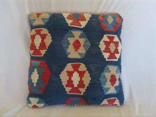 A VINTAGE HAND KNOTTED PERSIAN CUSHION