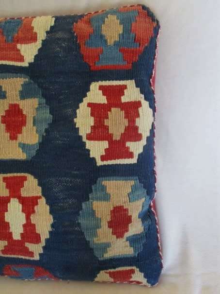 A VINTAGE HAND KNOTTED PERSIAN CUSHION