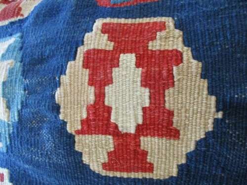 A VINTAGE HAND KNOTTED PERSIAN CUSHION