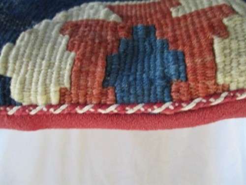 A VINTAGE HAND KNOTTED PERSIAN CUSHION
