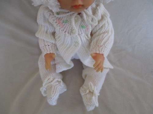 A 42CM TALL DRINK AND WET FIRST LOVE DOLL IN THE CUTEST HAND KNITTED OUTFIT