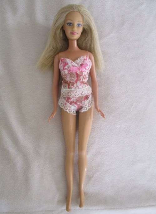 MATTEL BARBIE DOLL IN PJ`S AND GOWN AND WITH KNEES THAT BEND (PLUS EXTRA DRESS)