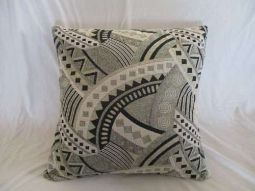 A STRIKING VERY LARGE CUSHION IN QUALITY WOVEN MATERIAL