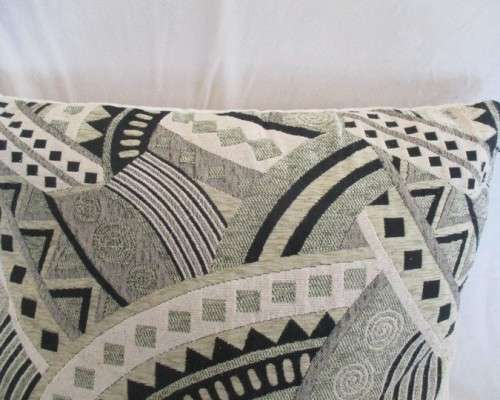 A STRIKING VERY LARGE CUSHION IN QUALITY WOVEN MATERIAL