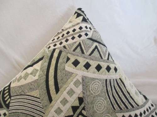 A STRIKING VERY LARGE CUSHION IN QUALITY WOVEN MATERIAL