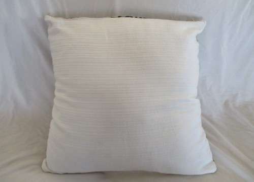 A STRIKING VERY LARGE CUSHION IN QUALITY WOVEN MATERIAL