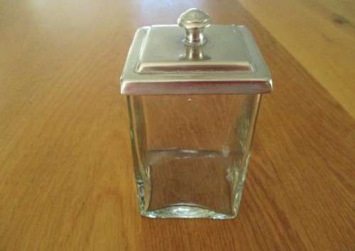 A HANDY SMALL GLASS CANNISTER WITH METAL LID