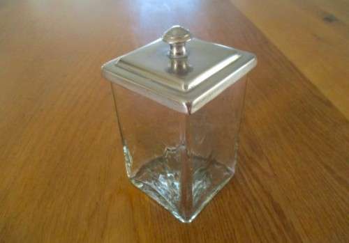 A HANDY SMALL GLASS CANNISTER WITH METAL LID