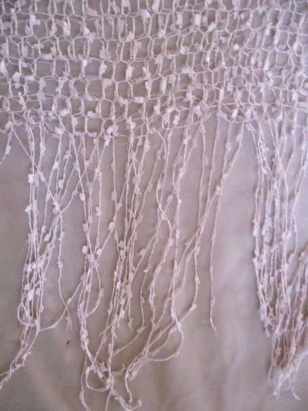 A DELICATE, FEMININE POWDER PINK SHAWL WITH LONG TASSELS AND SILVER STRANDS