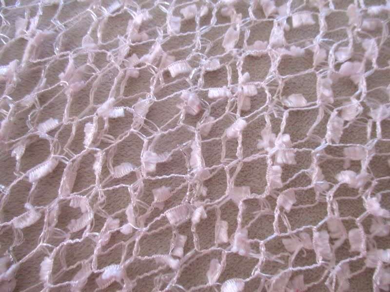 A DELICATE, FEMININE POWDER PINK SHAWL WITH LONG TASSELS AND SILVER STRANDS