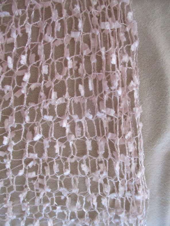 A DELICATE, FEMININE POWDER PINK SHAWL WITH LONG TASSELS AND SILVER STRANDS