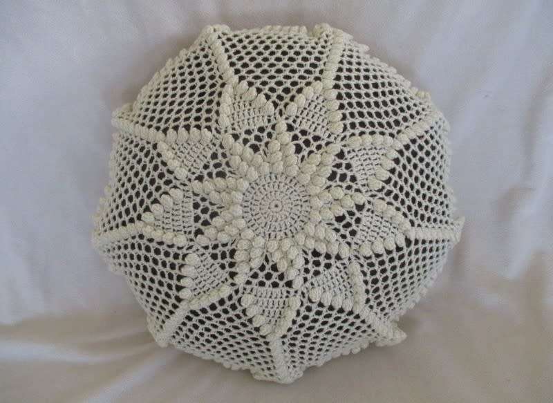 A small vintage hand crocheted cushion - expertly crocheted