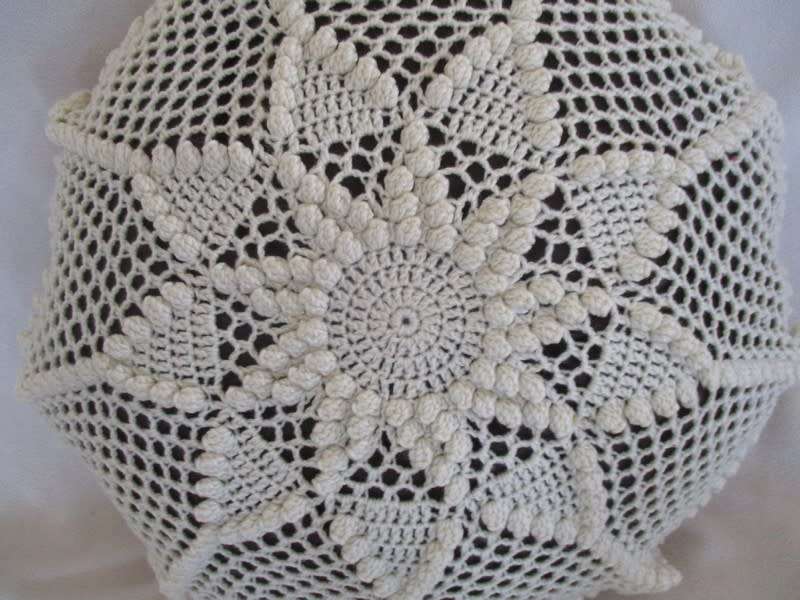 A small vintage hand crocheted cushion - expertly crocheted