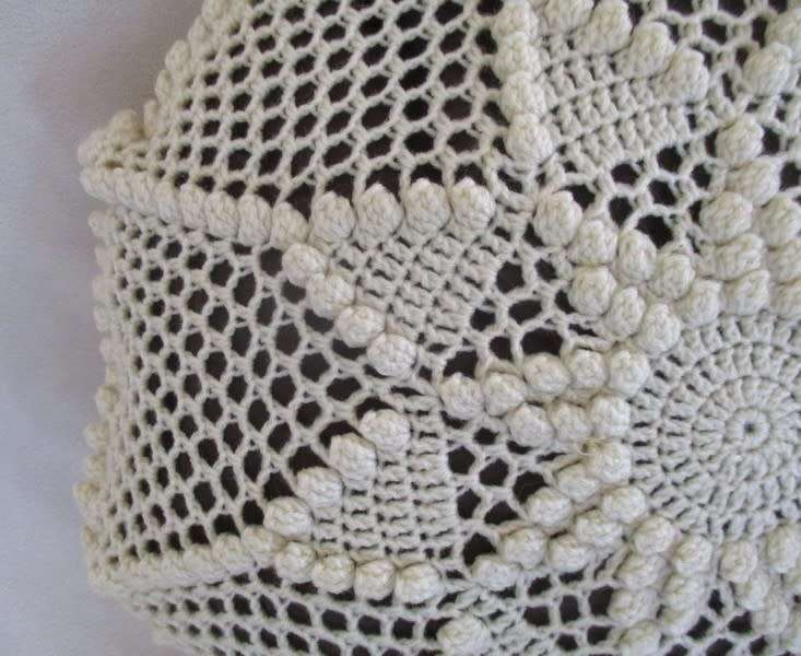 A small vintage hand crocheted cushion - expertly crocheted