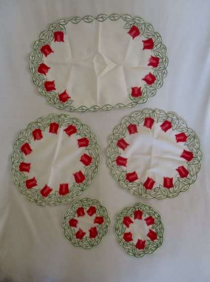 A set of five cloths - appliqued and embroidered with pretty Dutch tulips