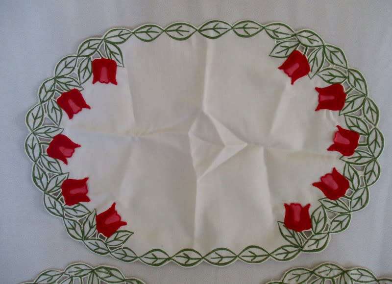 A set of five cloths - appliqued and embroidered with pretty Dutch tulips