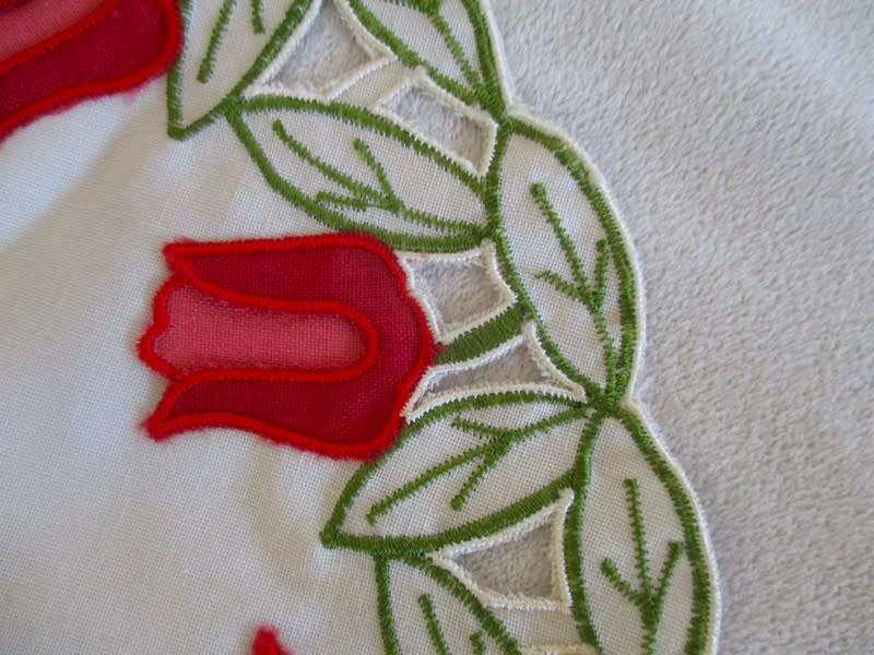 A set of five cloths - appliqued and embroidered with pretty Dutch tulips