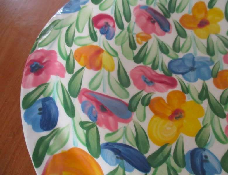 Large hand painted bowl with cheerful floral design