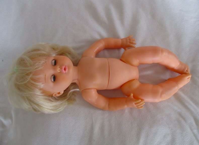Beautiful First Love Baby Love twisty body doll holding her own vintage dolly