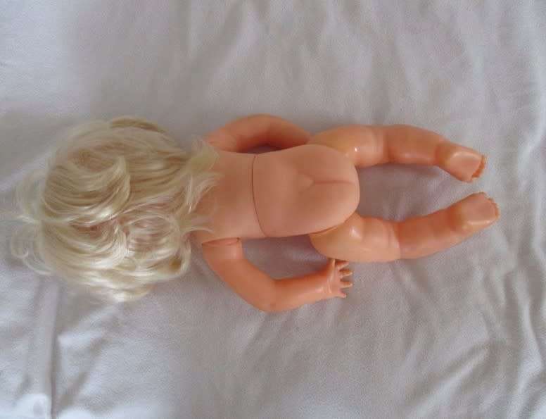 Beautiful First Love Baby Love twisty body doll holding her own vintage dolly