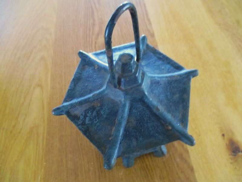 A vintage Japanese cast iron pagoda candle lantern for garden or patio