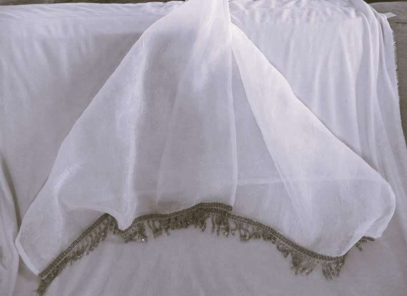 A stunning large, gossamer cloth with pretty beaded tassels