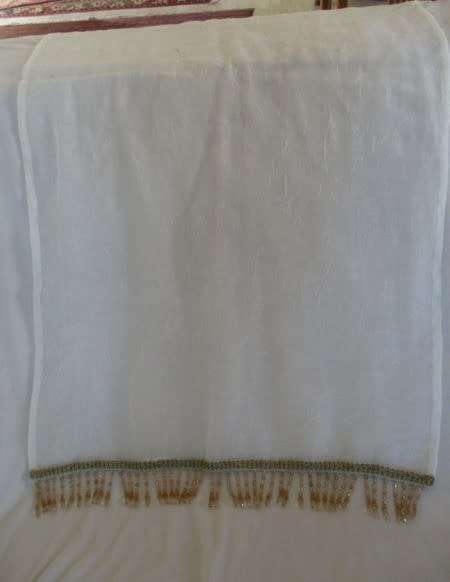 A stunning large, gossamer cloth with pretty beaded tassels