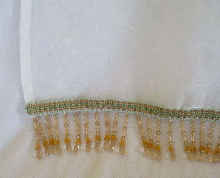 A stunning large, gossamer cloth with pretty beaded tassels