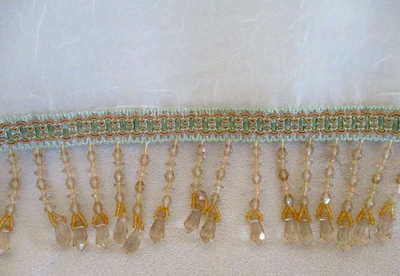 A stunning large, gossamer cloth with pretty beaded tassels