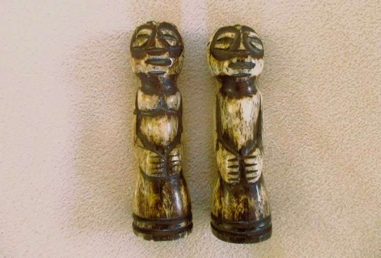 Two very old carved bone Luba/Songwe, Congo potion holders/talismans with original stoppers