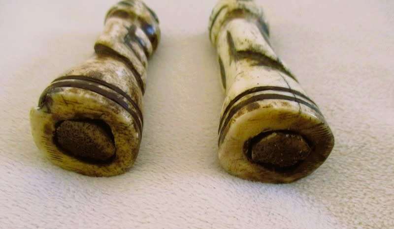 Two very old carved bone Luba/Songwe, Congo potion holders/talismans with original stoppers