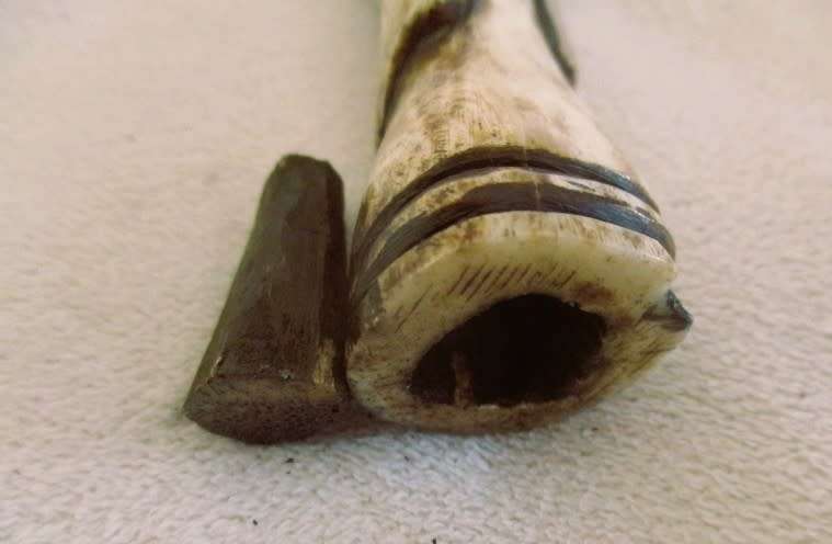 Two very old carved bone Luba/Songwe, Congo potion holders/talismans with original stoppers