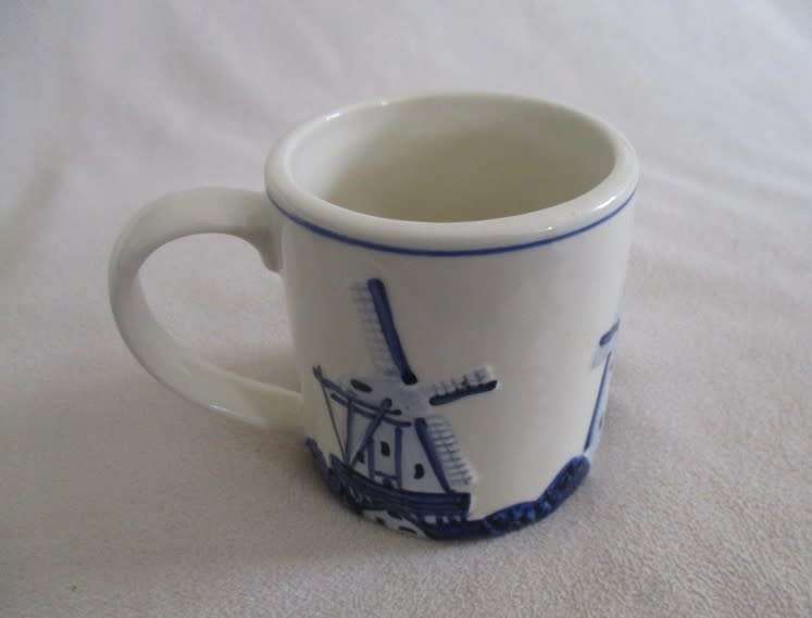 A blue and white Trophee coffee cup made in Holland