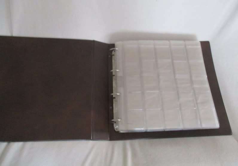 An empty album for storing 35mm slides  - storage pockets for 1000 slides (or postage stamps)