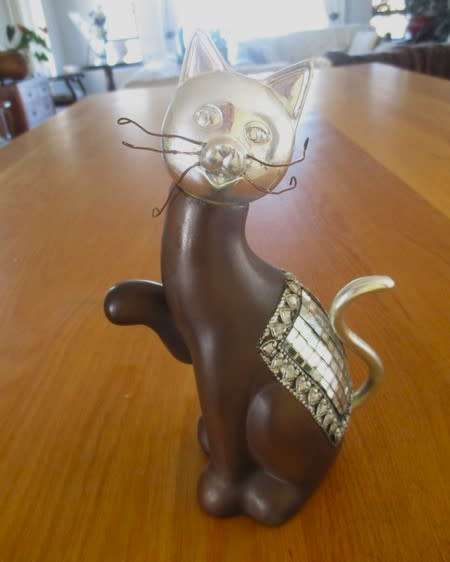 Cute ceramic cat with silver metal and little mirror detail (please disregard reflections)