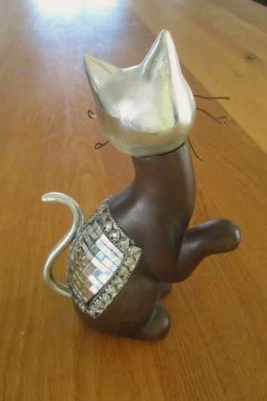 Cute ceramic cat with silver metal and little mirror detail (please disregard reflections)