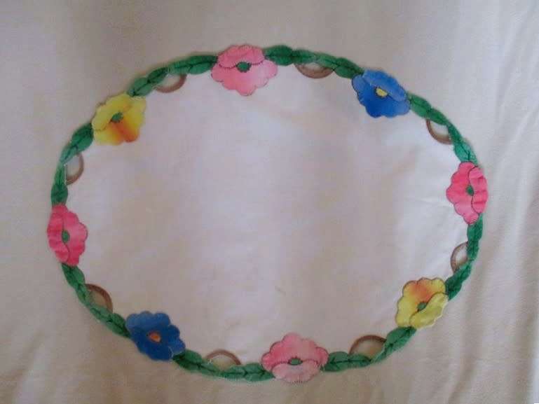 Vintage oval cloth with appliqued floral border