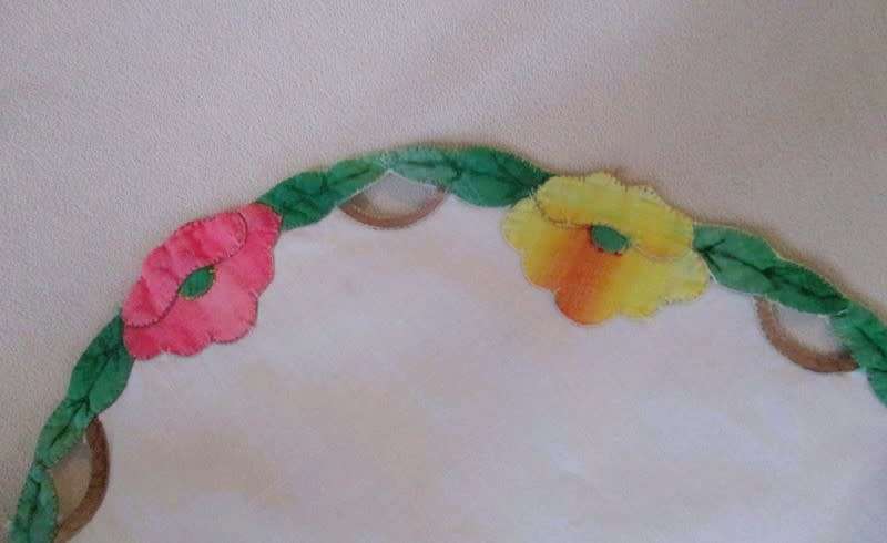 Vintage oval cloth with appliqued floral border