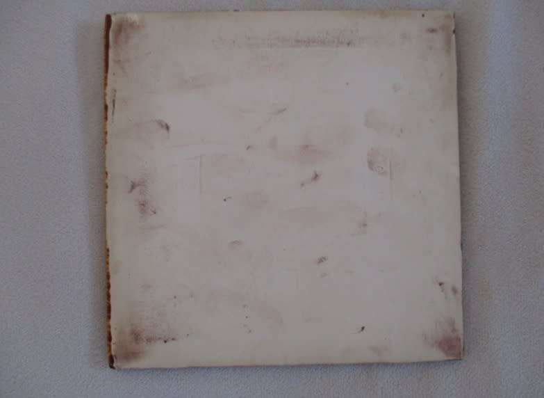 A vintage 1960`s hand painted and glazed Liebermann tile of a man with his bottle - discontinued